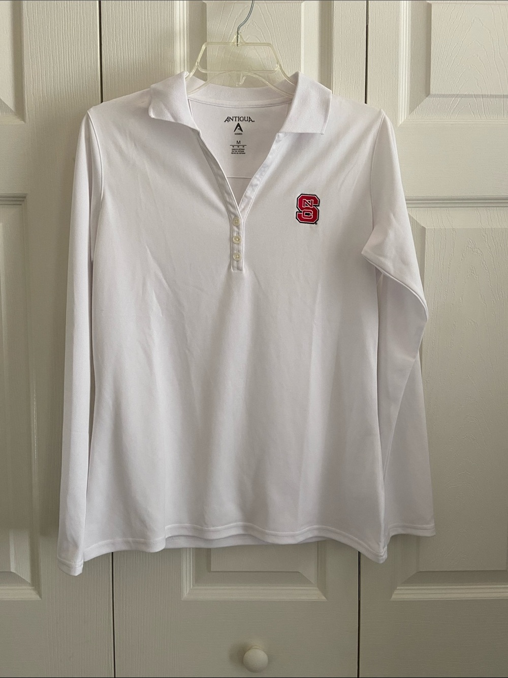 Antigua Women’s White Long-Sleeve Polo with Red NC State Logo